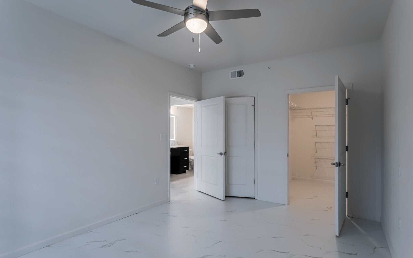 Interior of living room with large ceiling fan
