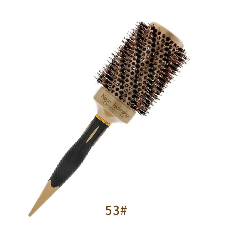 Un cepillo redondo de color dorado y negro con mango puntiagudo, etiquetado como 53#.