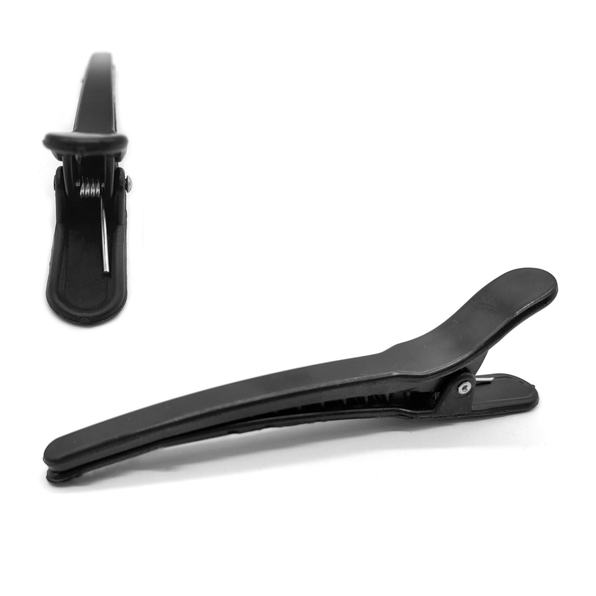 Dos horquillas negras de plástico para peluquería, mostradas desde ángulos laterales y frontales sobre un fondo blanco.