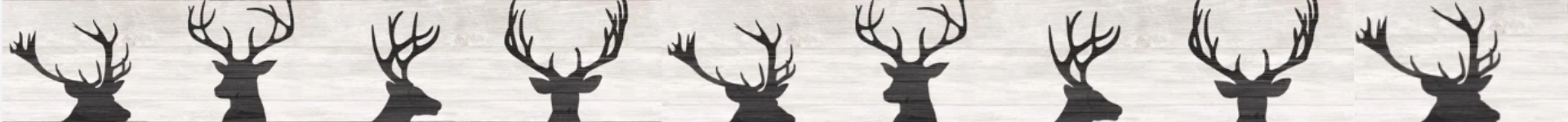 Shadow silhouettes of deer antlers in a line.