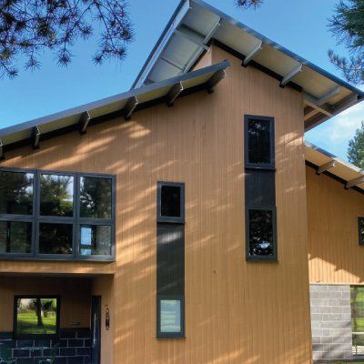 a house with a lot of windows and a roof