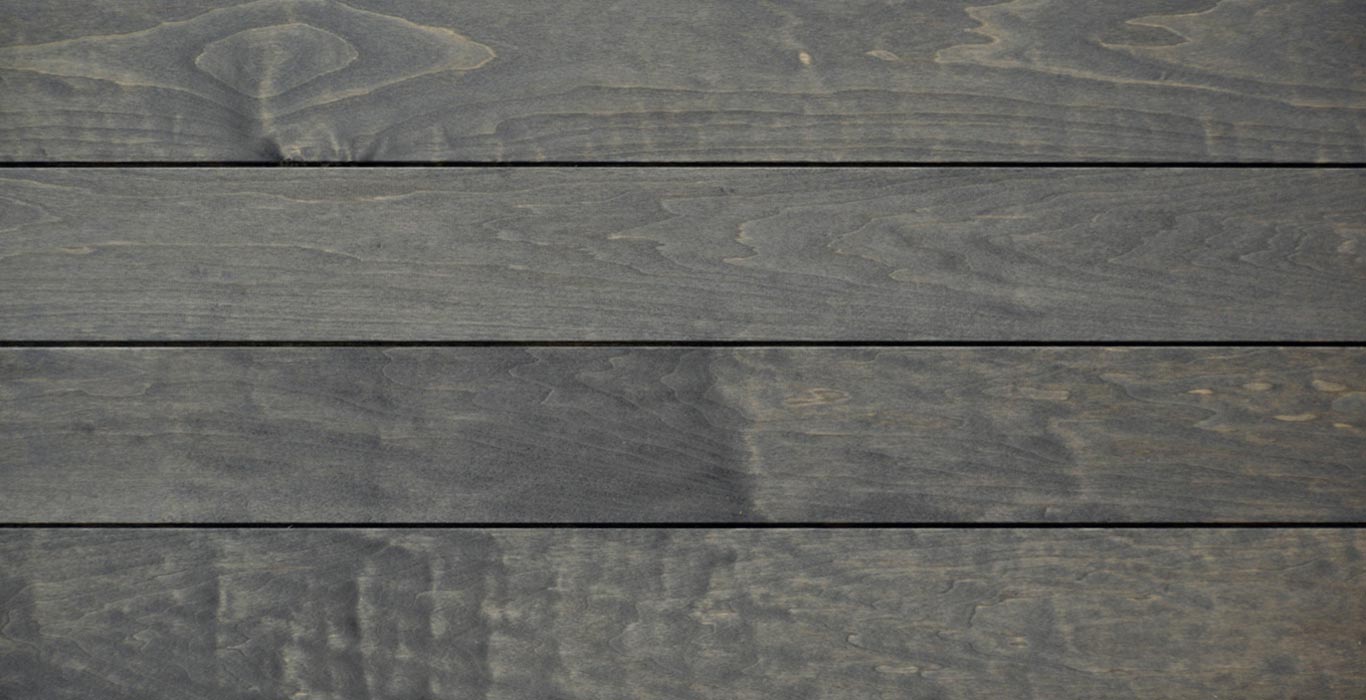 a close up of a gray wooden surface with a striped pattern .