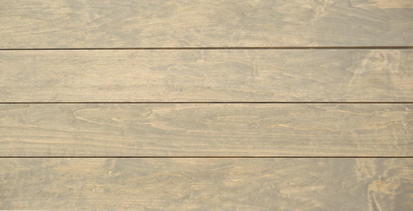 a close up of a wooden surface with a few lines on it .