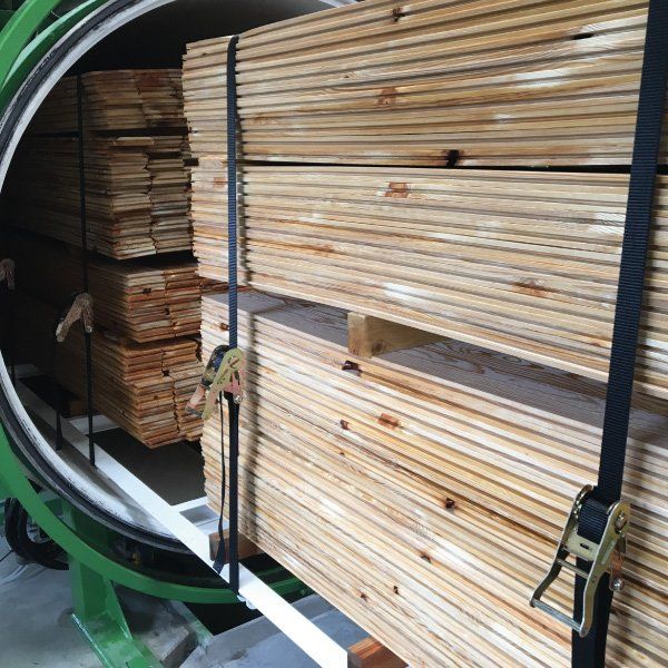 Timber being Fire Treated in a pressure chamber autoclave