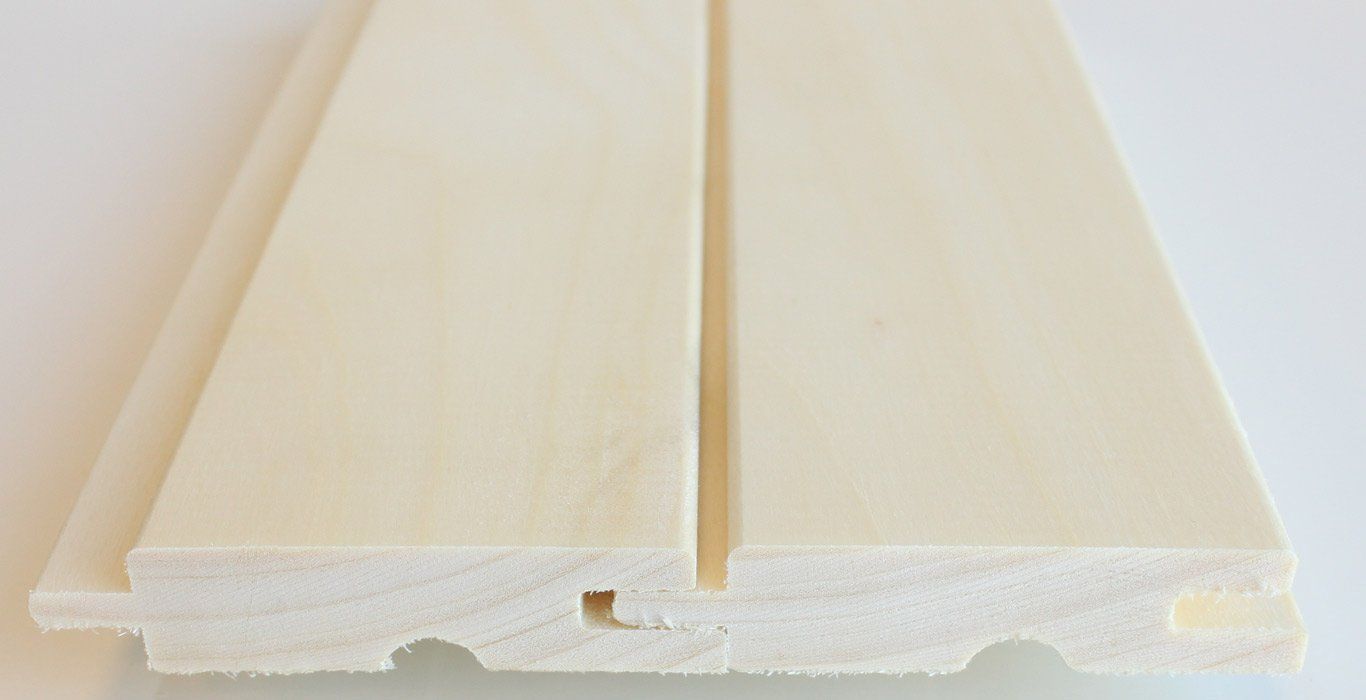 a close up of a piece of white wood on a white surface .
