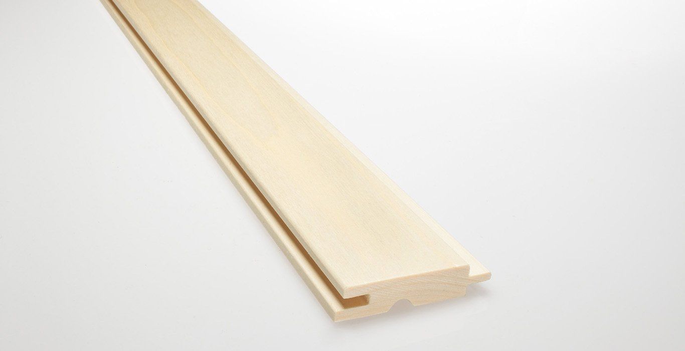 a piece of wood is sitting on a white surface .