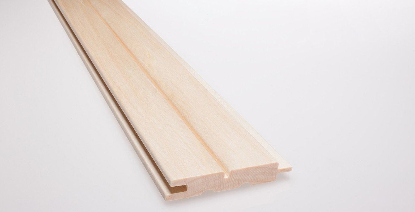 a piece of wood is sitting on a white surface .