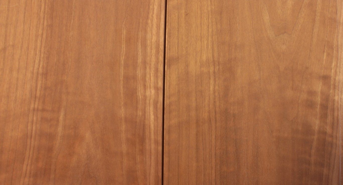 a close up of a piece of wood with a line between two pieces of wood .