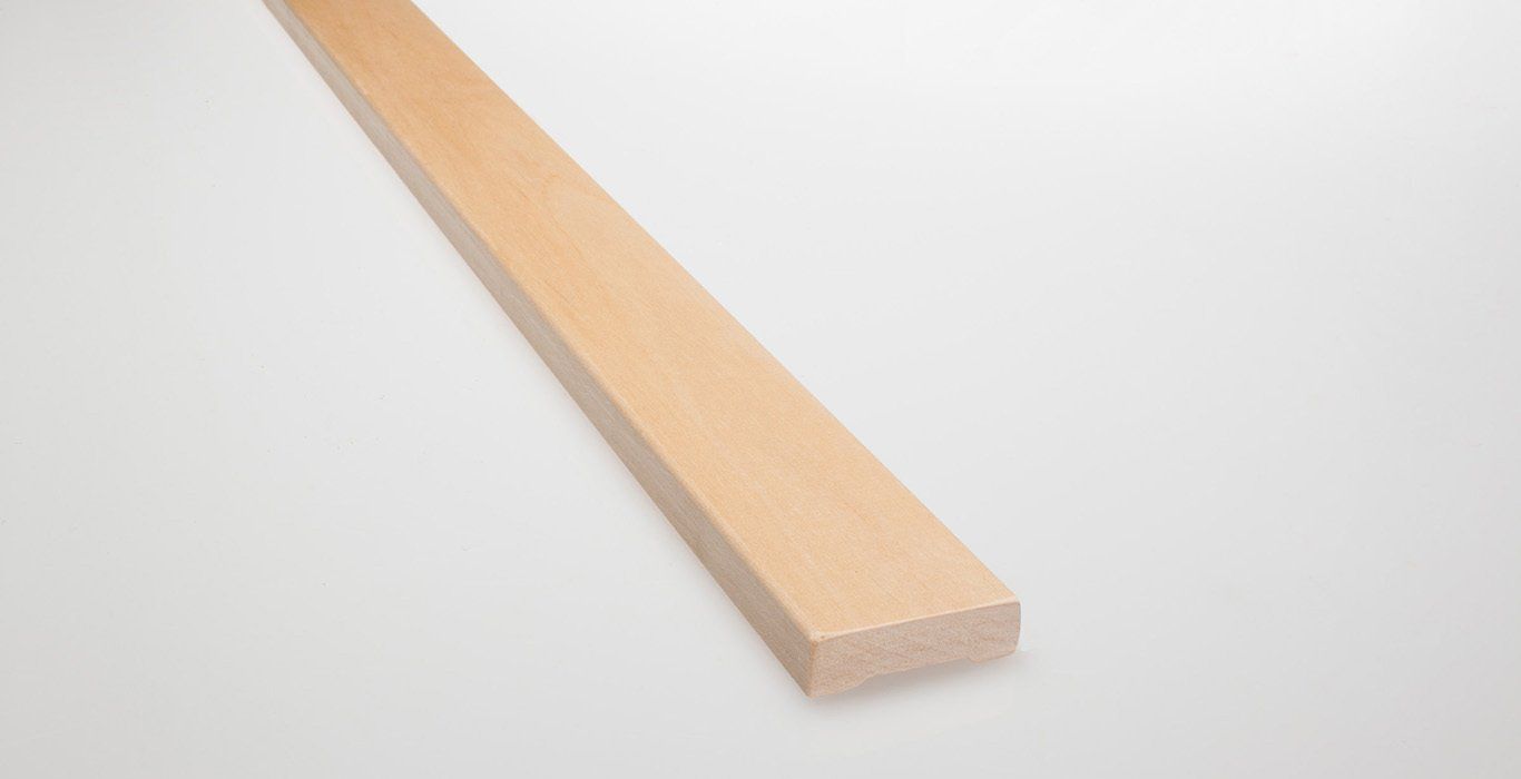 a piece of wood is sitting on a white surface .