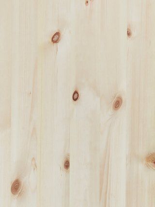 a close up of a piece of wood with holes in it .