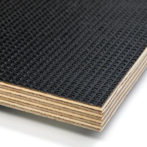 a close up of a piece of plywood with a black rubber mat on it .
