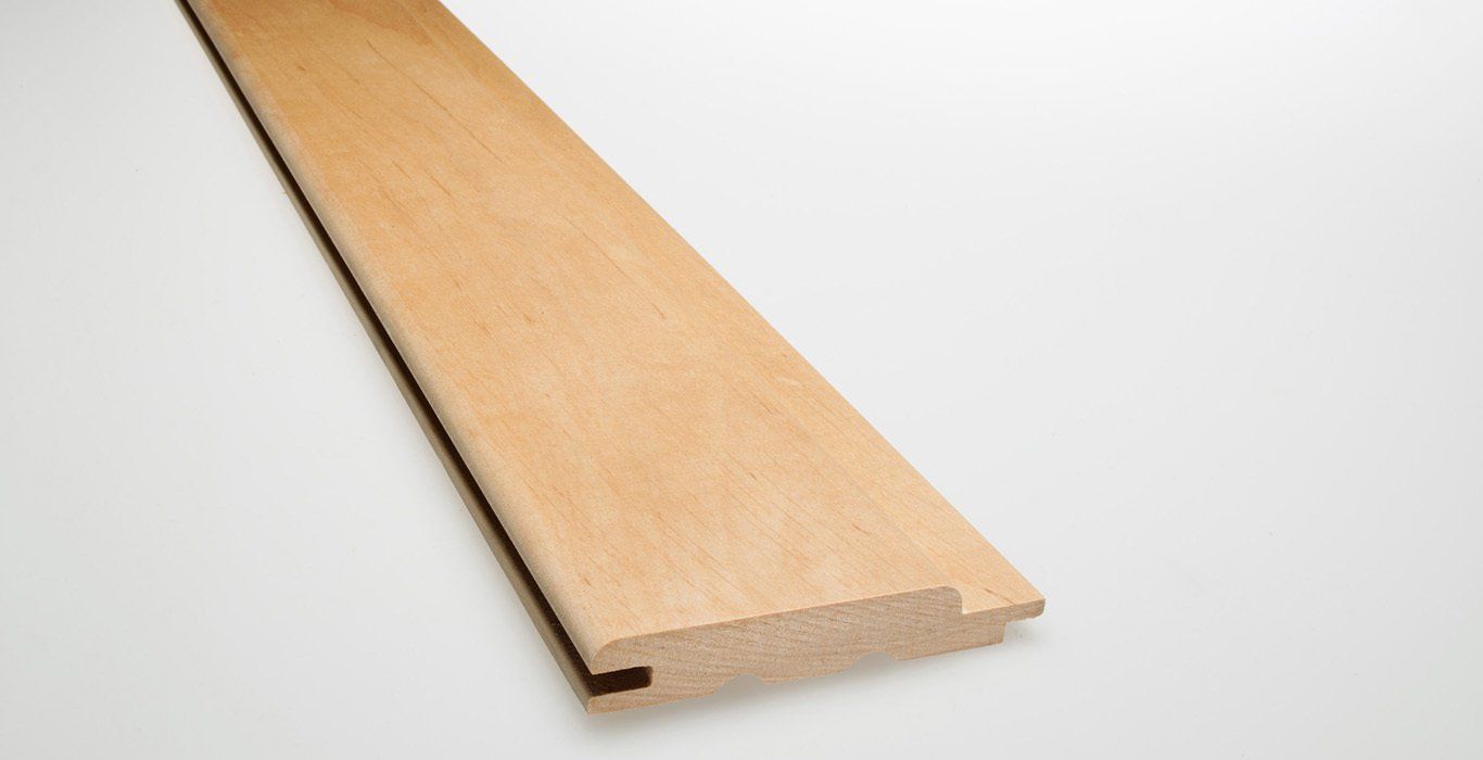 a piece of wood is sitting on a white surface .