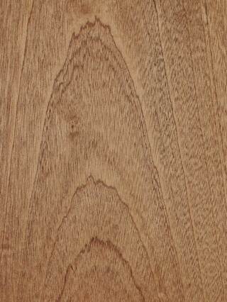 a close up of a piece of wood with a grain pattern .