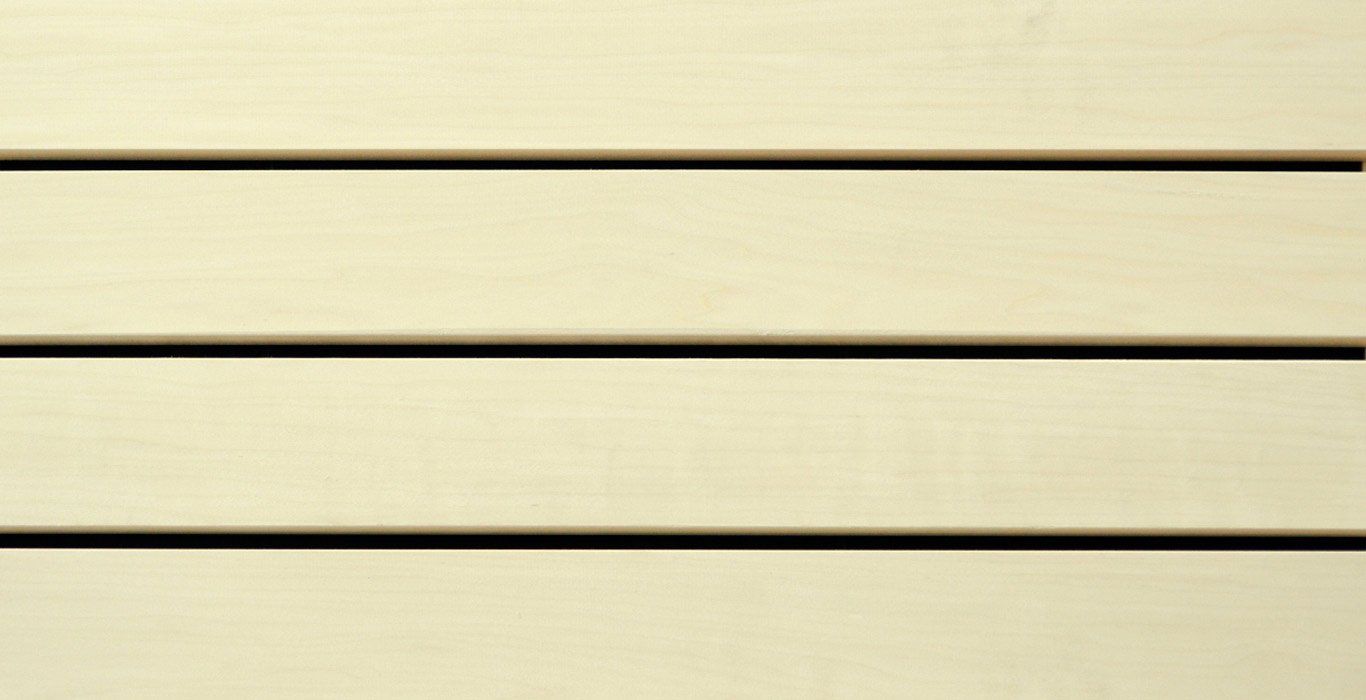 a close up of a white wooden wall with black stripes .