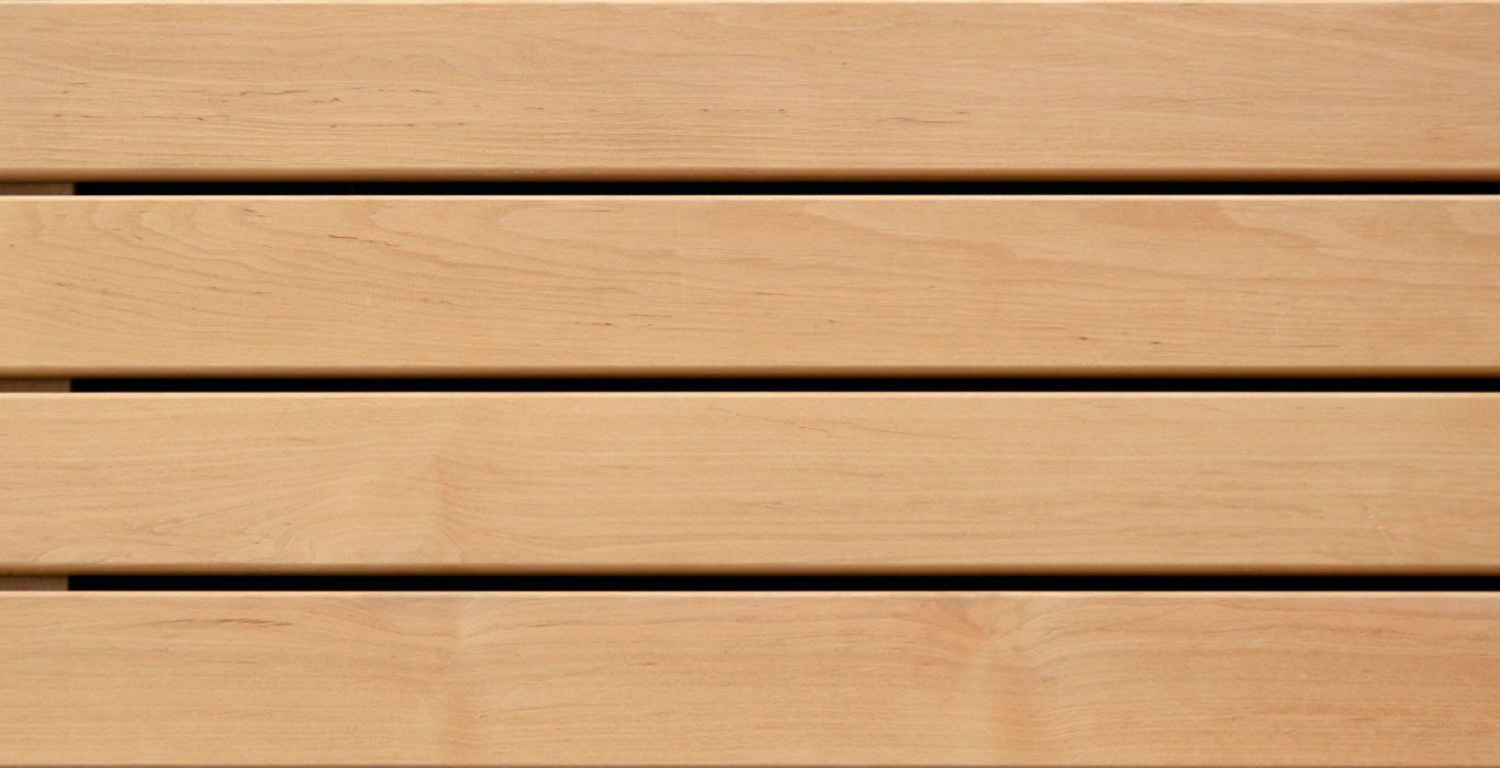 a close up of a wooden plank with a black border .