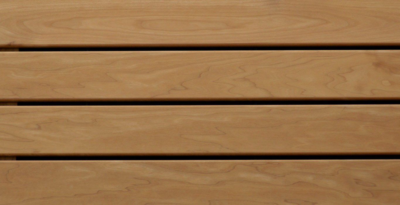 a close up of a wooden surface with a few lines on it .