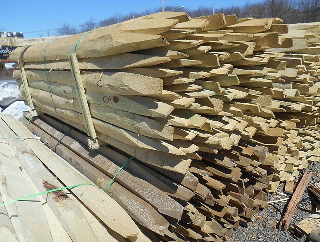A pile of wood is stacked on top of each other.
