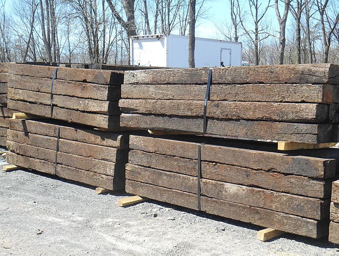 A pile of wooden beams stacked on top of each other