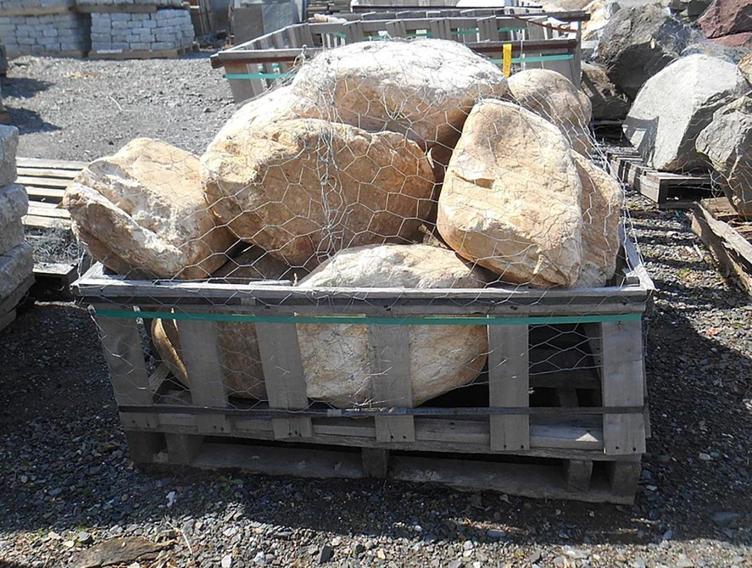 A pile of rocks sitting on top of a wooden pallet.