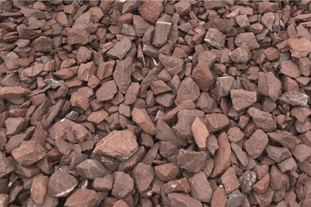 A pile of red rocks sitting on top of each other.