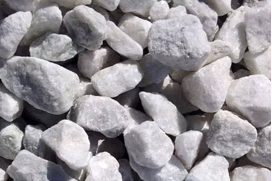 A pile of white rocks sitting on top of each other on a table.