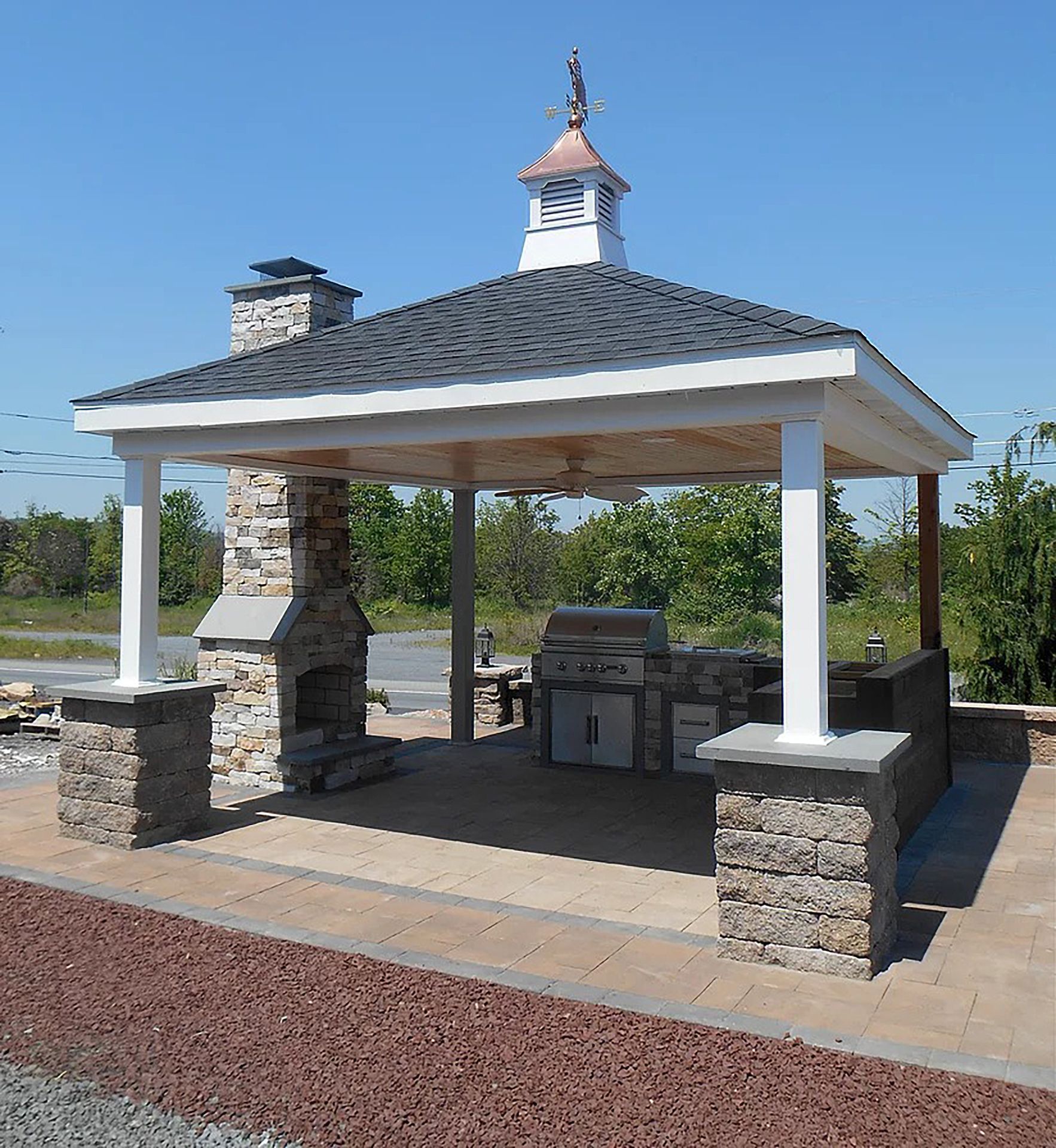 A custom gazebo or pergola with a clock on top of it
