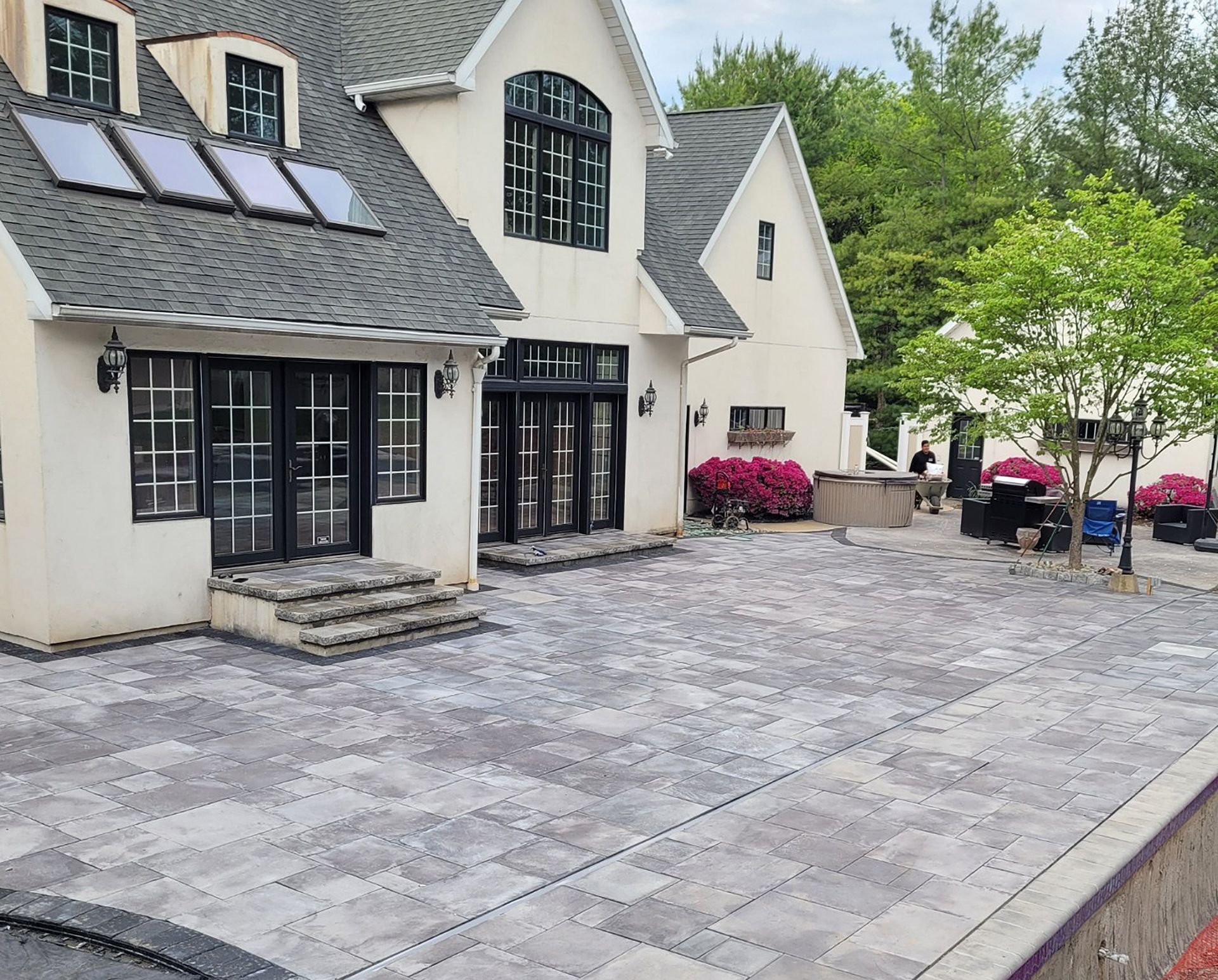A large white house with a patio in front of it
