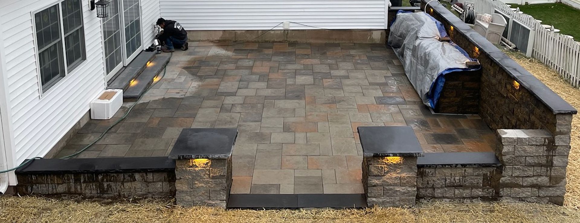 An aerial view of a patio with a grill and steps leading to it.