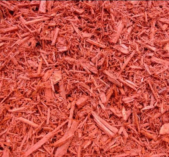 A close up of red dyed mulch