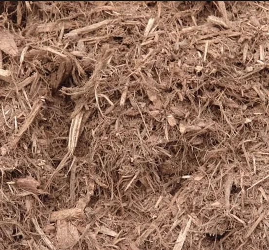 A close up of triple shred natural brown mulch