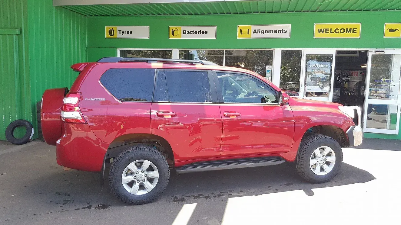 Red SUV at the Shop Front— Manjimup, WA — Manjimup Tyre Mart & Auto Electrical Services