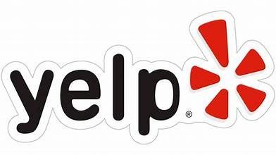 A yelp logo with a red star on a white background.