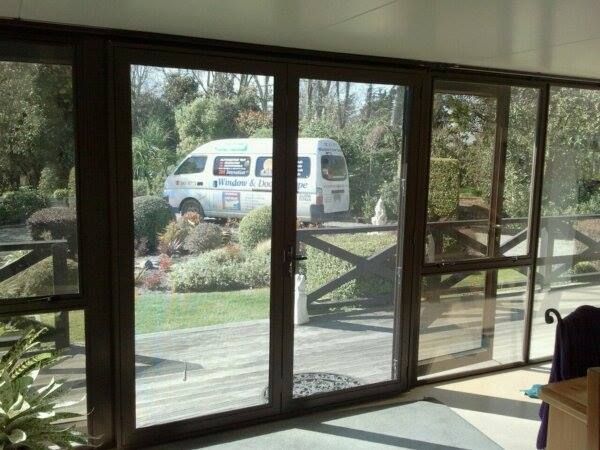 A white van is parked in the backyard of a house