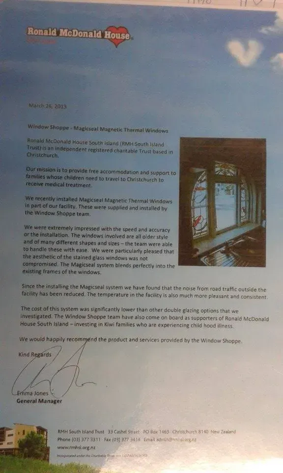 A letter with a picture of a stained glass window on it.