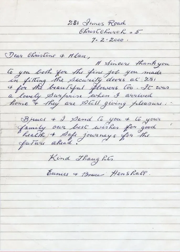 A letter is written in cursive on a piece of paper