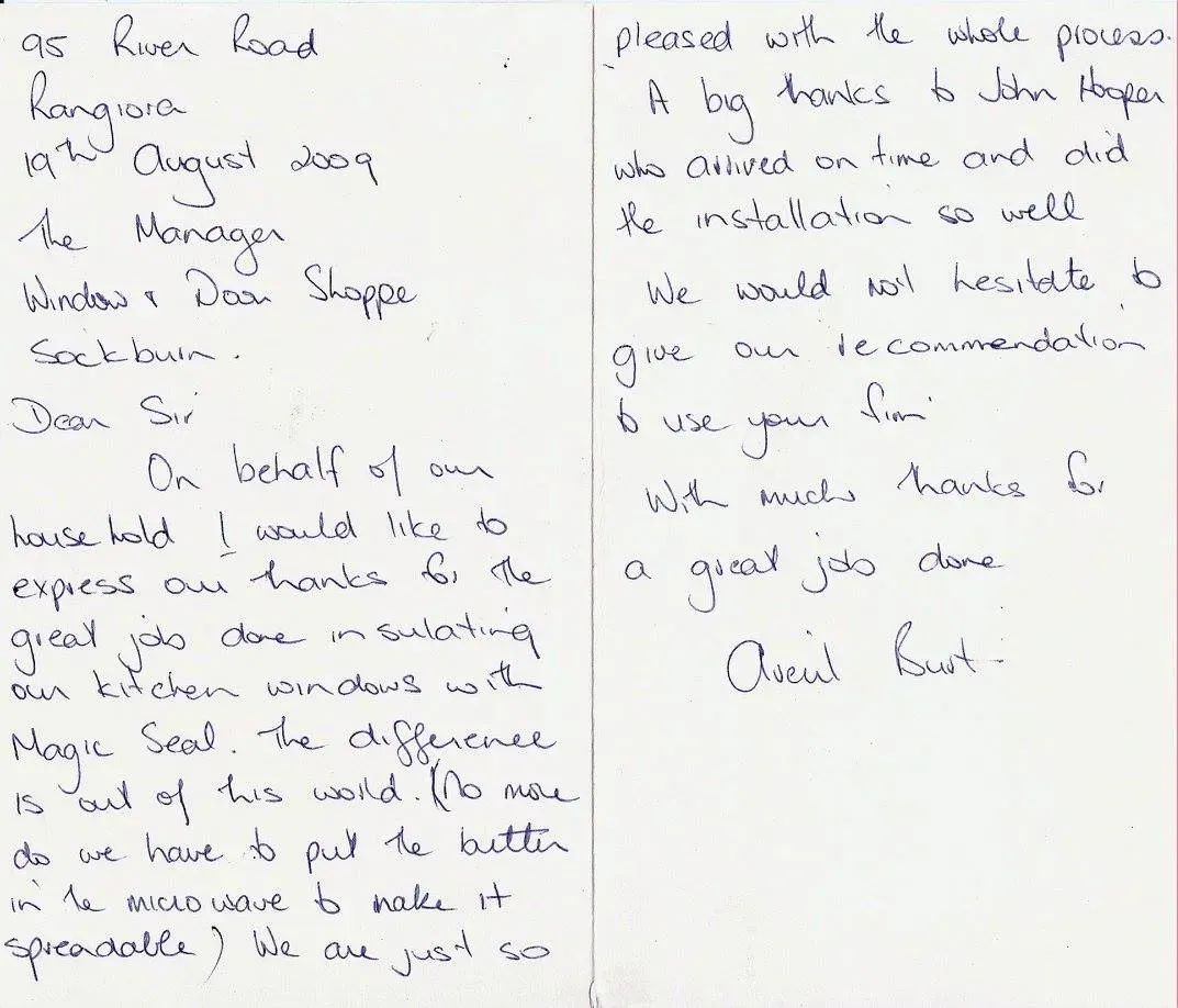 A letter is written in cursive on a piece of paper