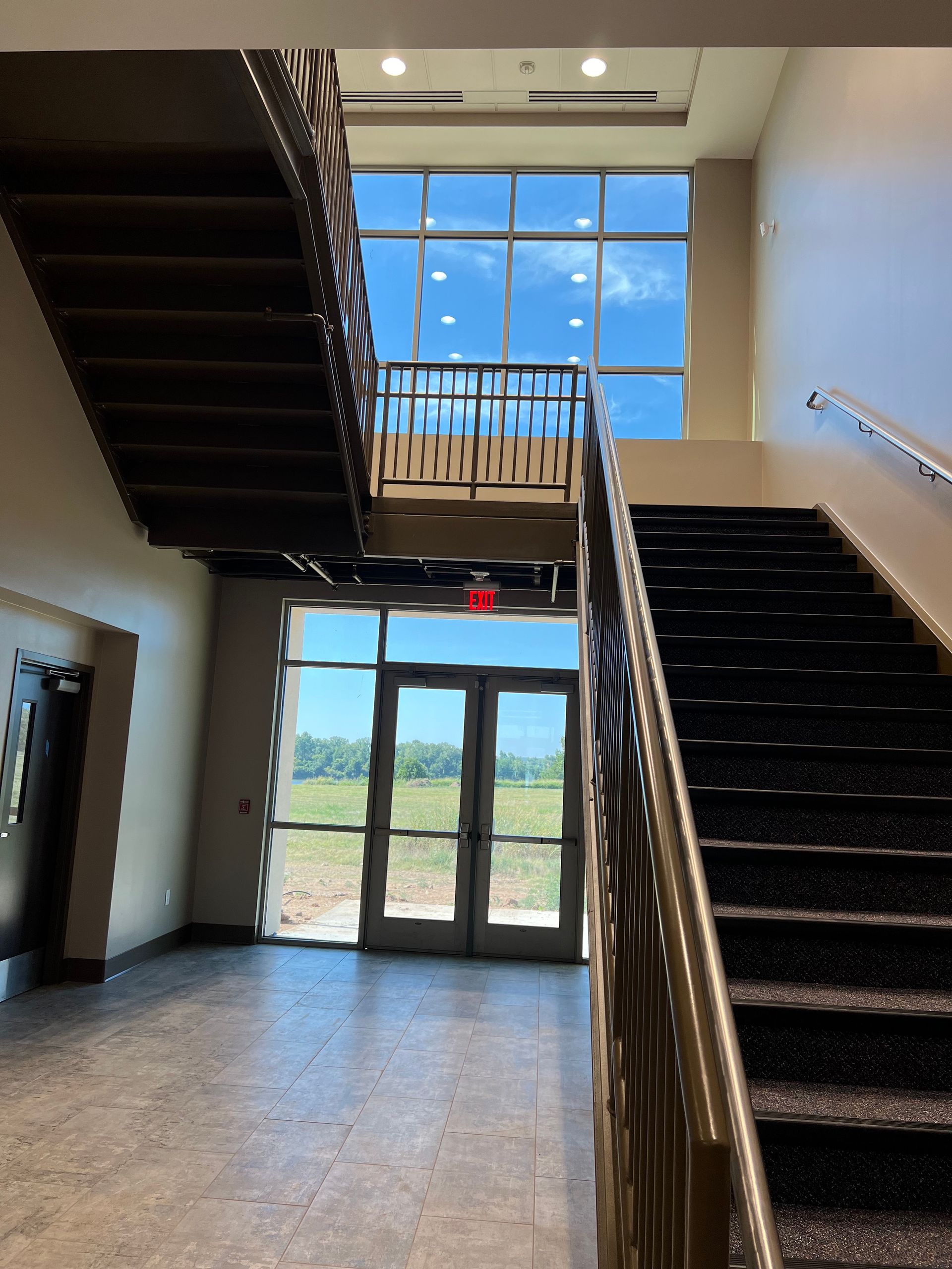 A staircase in a building with a large window