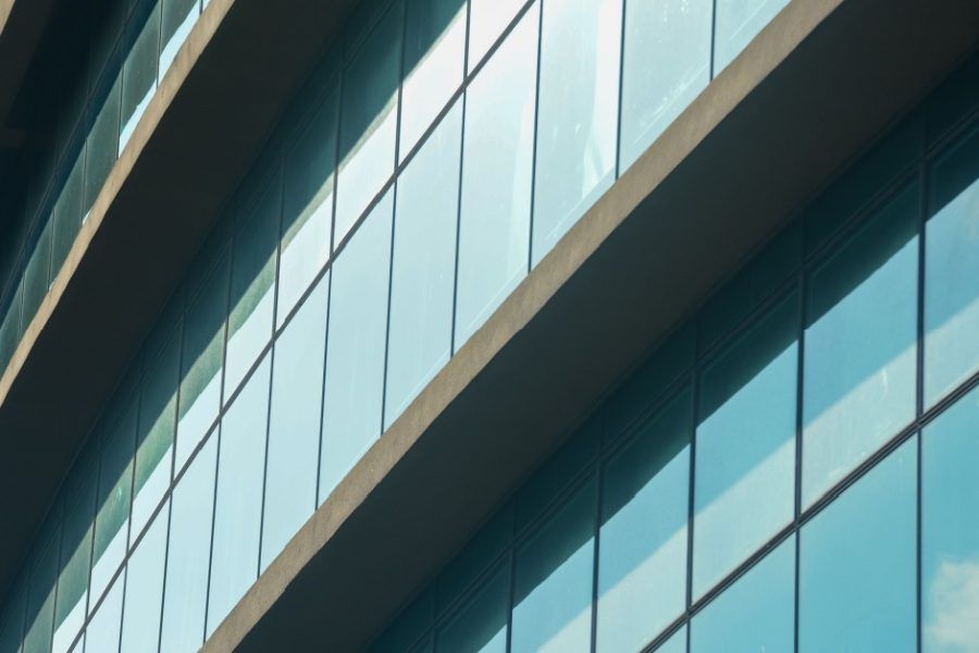 A close up of a tall building with lots of windows.