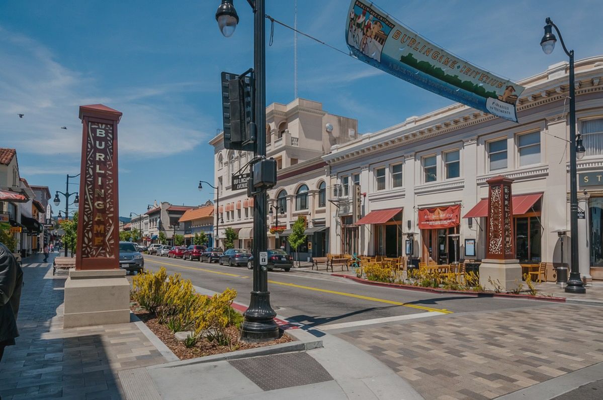 A city street with a lot of buildings and a street light.