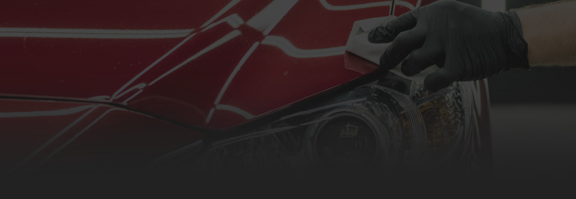 Up close to technician cleaning red car | Flame Auto Repair