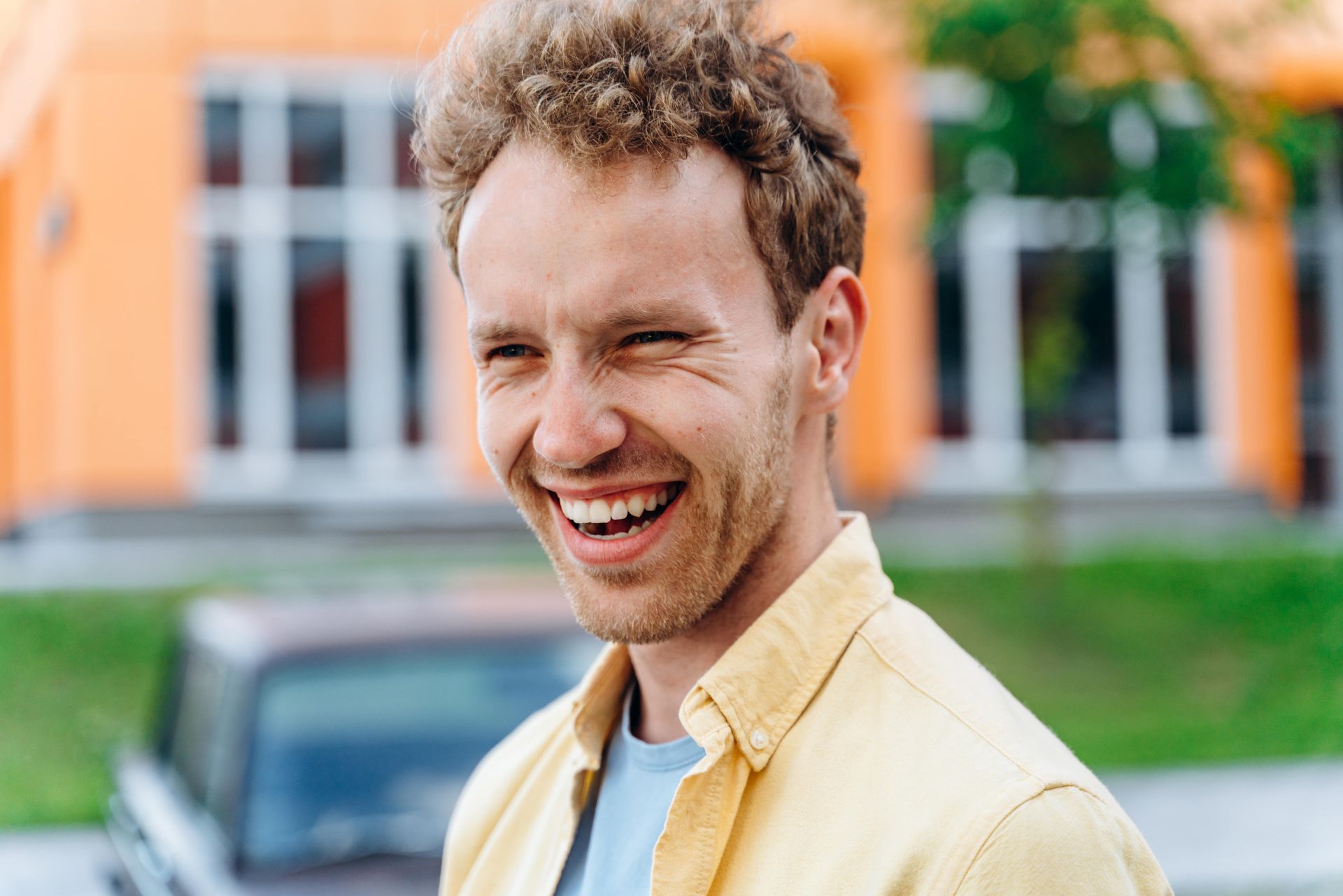 A person wearing a leopard print dress and a necklace.