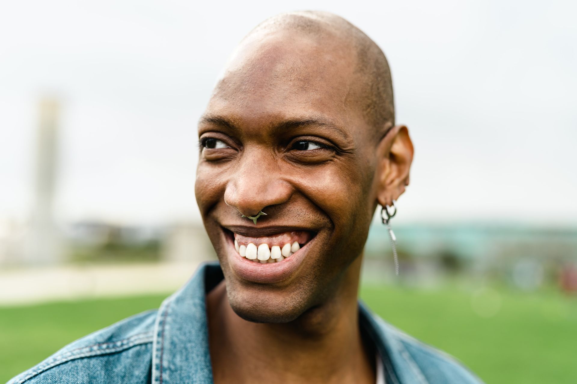 A person wearing a leopard print dress and a necklace.