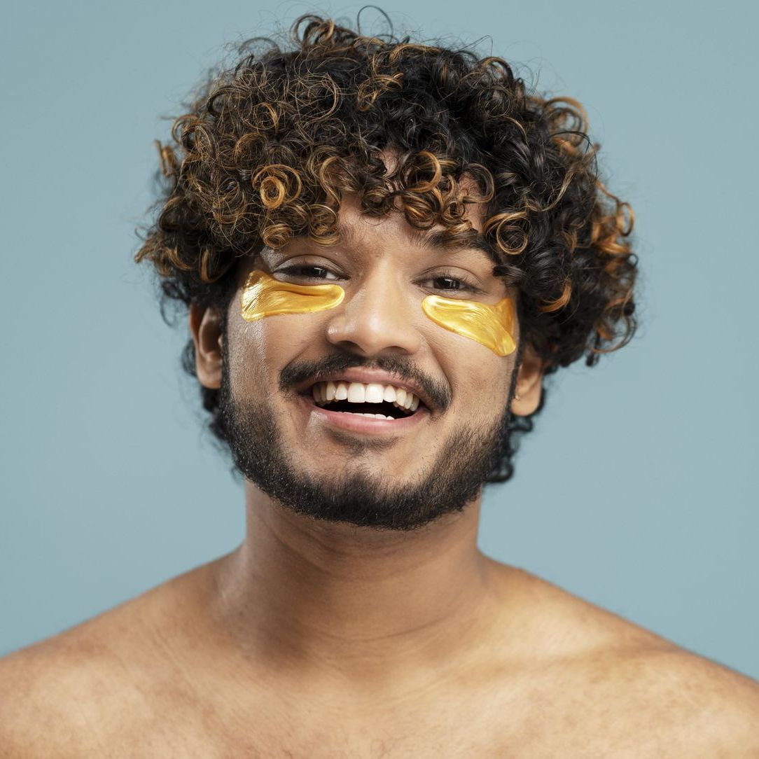 A person wearing a leopard print dress and a necklace.