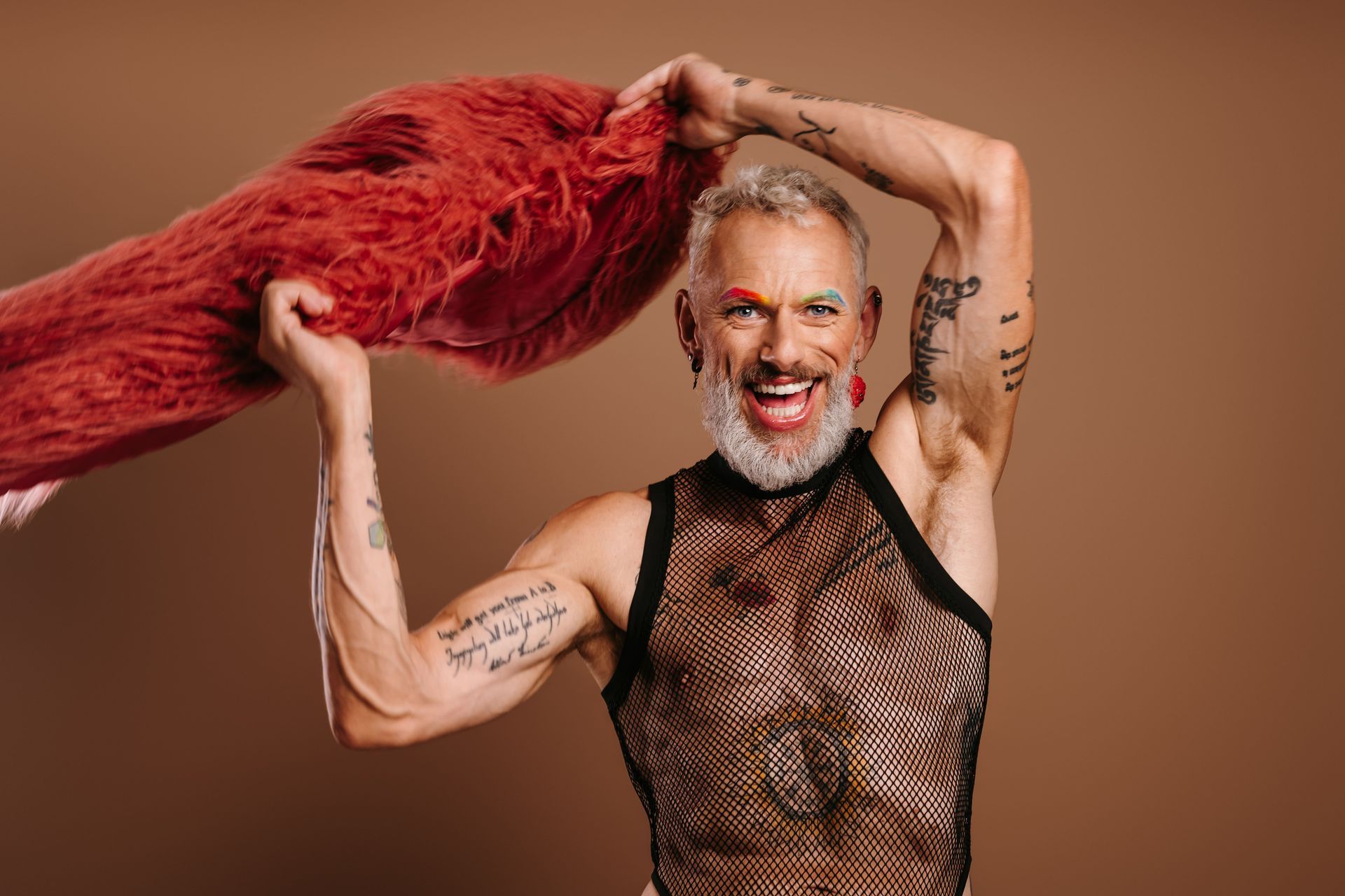 A person wearing a leopard print dress and a necklace.