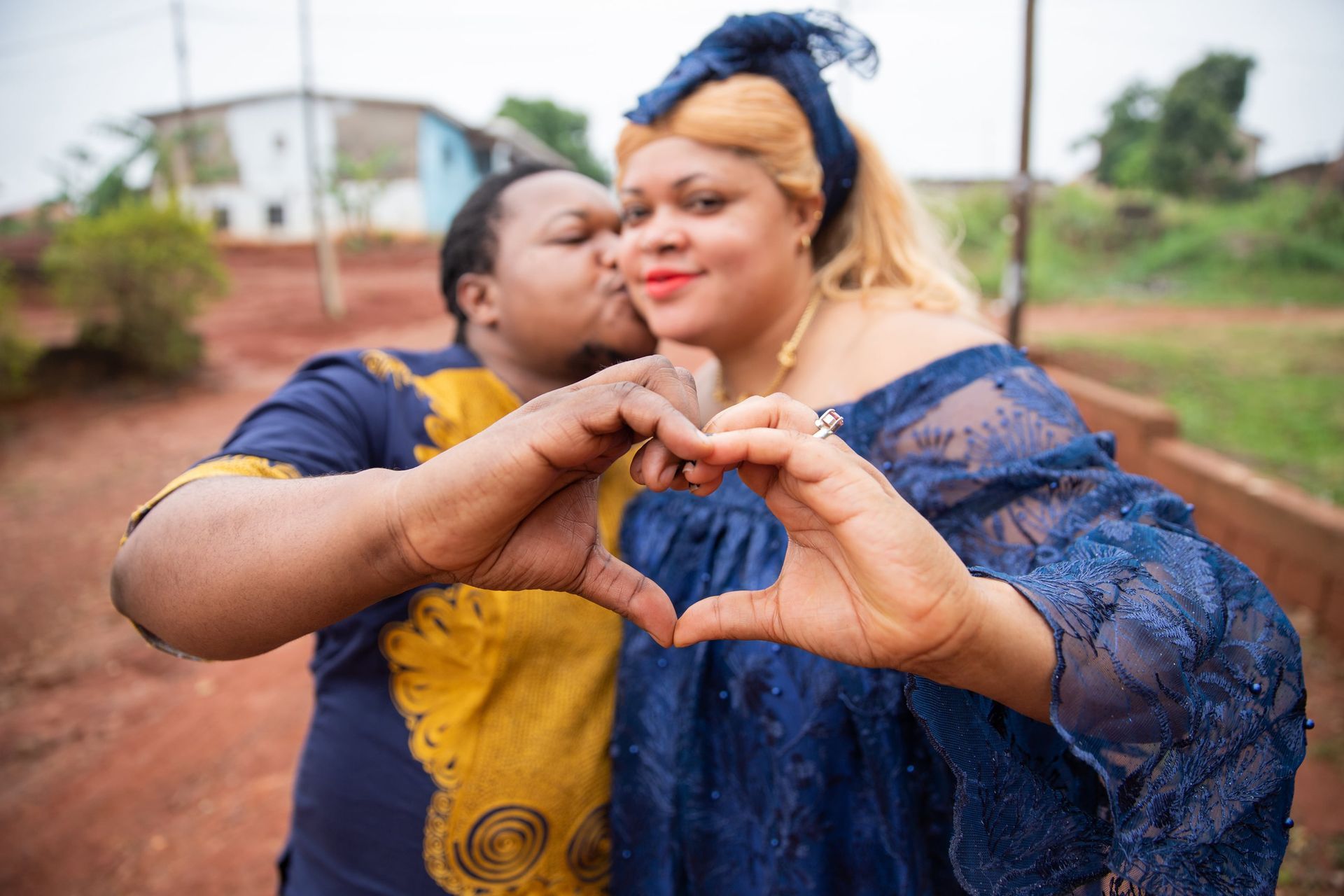 A person wearing a leopard print dress and a necklace.