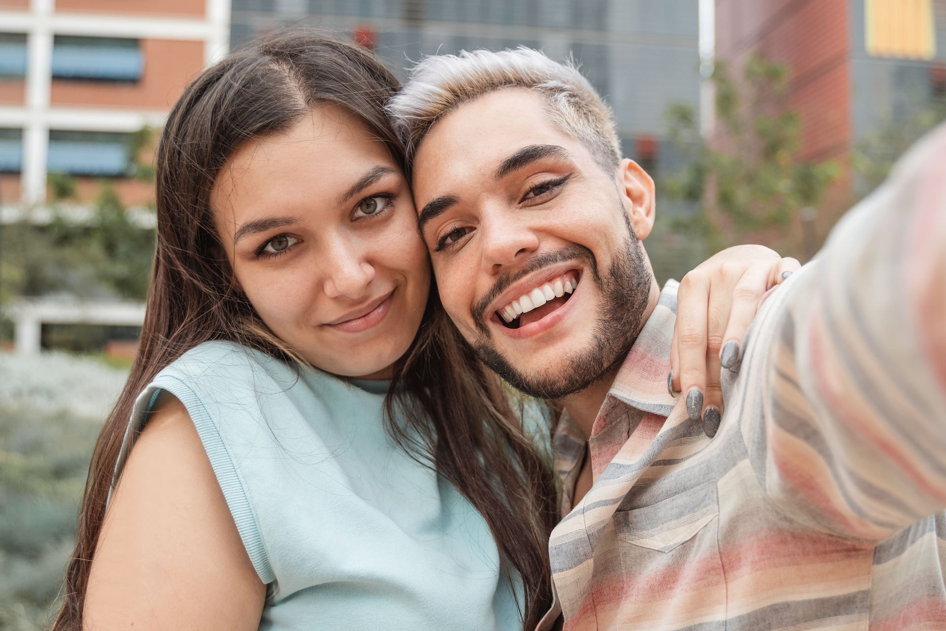 Friends are taking a selfie together.