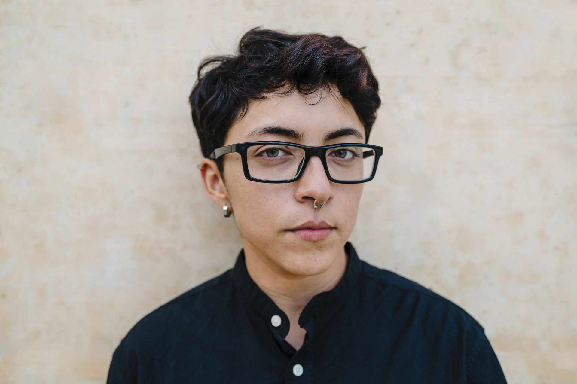 A person wearing a leopard print dress and a necklace.