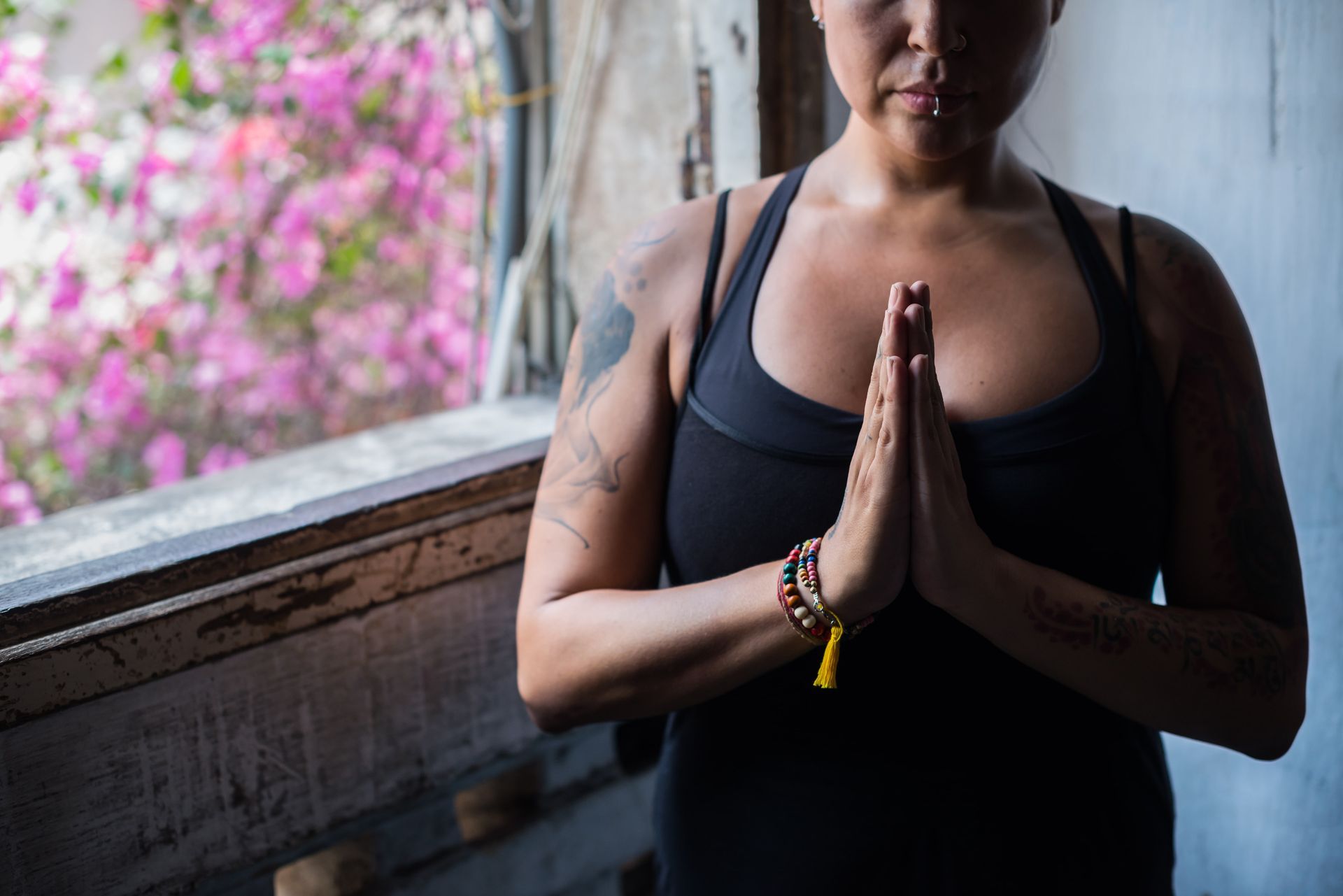 A person wearing a leopard print dress and a necklace.
