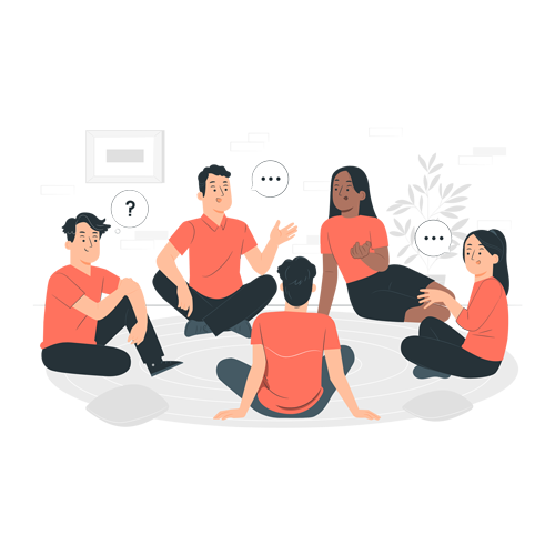 A group of people are sitting in a circle on the floor talking to each other.