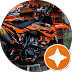 Orange motorcycle parts, black engine, and a toolbox.